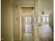 Hallway leads to a living area with decorative columns and lots of windows at 211 Providence Glen, Chapel Hill, NC 27514