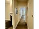 Hallway showing the transition to a living space and other rooms throughout the home at 211 Providence Glen, Chapel Hill, NC 27514