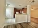 Kitchen with wood cabinets and white appliances and access to a pantry at 211 Providence Glen, Chapel Hill, NC 27514