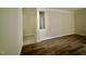 A living room features hard wood flooring and a neutral color scheme at 211 Providence Glen, Chapel Hill, NC 27514