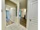 View from the front entry shows an open living room with wood floors and a fireplace at 211 Providence Glen, Chapel Hill, NC 27514