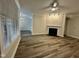 Bright living room with a fireplace and hardwood floors at 211 Providence Glen, Chapel Hill, NC 27514