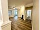 The living room features hardwood floors and leads to a dining area at 211 Providence Glen, Chapel Hill, NC 27514