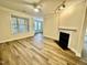 This living room has hardwood floors, a fireplace and a ceiling fan at 211 Providence Glen, Chapel Hill, NC 27514