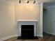 Living room showcases a contemporary fireplace beneath recessed lighting, blending style with function at 211 Providence Glen, Chapel Hill, NC 27514
