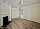 A living room featuring a fireplace, ceiling fan, and beautiful hardwood floors at 211 Providence Glen, Chapel Hill, NC 27514