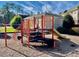 A community playground featuring various play structures and equipment at 211 Providence Glen, Chapel Hill, NC 27514