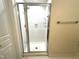 Shower featuring glass doors and tile surround at 211 Providence Glen, Chapel Hill, NC 27514