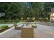 Backyard patio features an outdoor living area with basketball court and manicured landscaping at 2207 Vintage Hill Dr, Durham, NC 27712