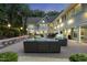Beautifully landscaped backyard with an outdoor seating area and stylish patio at 2207 Vintage Hill Dr, Durham, NC 27712