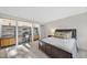 Comfortable bedroom with built-in shelving and a cozy reading nook; relaxing atmosphere at 2207 Vintage Hill Dr, Durham, NC 27712