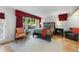 Cozy bedroom featuring a large window, hardwood floors, and modern furnishings at 2207 Vintage Hill Dr, Durham, NC 27712
