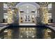 Grand entrance with stone archway, water feature and reflecting pool reflecting the doorway at 2207 Vintage Hill Dr, Durham, NC 27712