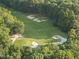 Scenic aerial view of a well-manicured golf course with sand traps at 2207 Vintage Hill Dr, Durham, NC 27712