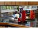 Close-up of modern kitchen accents, including red accents and coffee accessories at 2207 Vintage Hill Dr, Durham, NC 27712