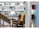 Bright living room with custom built in bookshelves and comfortable leather chair at 2207 Vintage Hill Dr, Durham, NC 27712