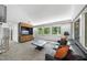 Comfortable living area with a spiral staircase, hardwood cabinets, and plush seating at 2207 Vintage Hill Dr, Durham, NC 27712