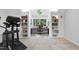 Bright office space features a window, built-in bookshelves, and exercise equipment at 2207 Vintage Hill Dr, Durham, NC 27712