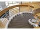 Detailed close up of the winding stairs with wood treads and metal railings at 2207 Vintage Hill Dr, Durham, NC 27712