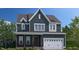 Charming two-story home featuring a two-car garage and traditional architectural details in a desirable community at 2220 Yumeewarra Dr, Apex, NC 27502