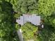 Overhead shot of a secluded home with a gray roof, surrounded by dense greenery and a driveway at 2306 Damascus Church Rd, Chapel Hill, NC 27516