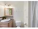 Cozy bathroom featuring a sink with a decorative backsplash and a shower with a patterned curtain at 2306 Damascus Church Rd, Chapel Hill, NC 27516