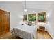Cozy bedroom featuring a comfortable bed, bedside tables with lamps, and natural light streaming through the windows at 2306 Damascus Church Rd, Chapel Hill, NC 27516