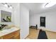 A bright exercise room with a mounted bench, wood floors, and a view of the greenery at 2306 Damascus Church Rd, Chapel Hill, NC 27516