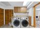 Functional laundry room with modern washer and dryer units and ample storage space at 2306 Damascus Church Rd, Chapel Hill, NC 27516