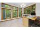 Bright office space with large windows, built-in desk, offering serene views of the surrounding woods at 2306 Damascus Church Rd, Chapel Hill, NC 27516