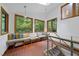 Cozy sitting area with large windows offering natural light and views of surrounding greenery at 2306 Damascus Church Rd, Chapel Hill, NC 27516