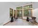 Cozy sitting area with modern chairs and windows offering natural light and views of surrounding greenery at 2306 Damascus Church Rd, Chapel Hill, NC 27516
