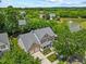 Aerial view of a beautiful home with a lush green landscape, and a pond nearby at 2419 Rogerson St, Raleigh, NC 27614