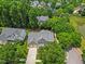 Lovely aerial view of a home with a large yard, mature trees, and a neatly manicured lawn at 2419 Rogerson St, Raleigh, NC 27614