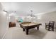 Basement area with pool table, seating, and neutral carpeting offers a great space for entertainment at 2419 Rogerson St, Raleigh, NC 27614