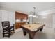 Basement features a billiards table, bar area, and custom lighting for entertaining and relaxation at 2419 Rogerson St, Raleigh, NC 27614