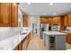 Well-appointed kitchen with stainless steel appliances, custom cabinetry, and ample counter space at 2419 Rogerson St, Raleigh, NC 27614