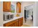 Kitchen counter with modern appliances and adjacent breakfast area at 2419 Rogerson St, Raleigh, NC 27614