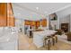 Gourmet kitchen with stainless steel appliances, quartz countertops, and breakfast bar at 2419 Rogerson St, Raleigh, NC 27614