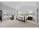 Serene main bedroom features vaulted ceilings, large windows with shutters, and neutral decor at 2419 Rogerson St, Raleigh, NC 27614