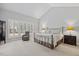 Serene main bedroom features vaulted ceilings, large windows with shutters, and neutral decor at 2419 Rogerson St, Raleigh, NC 27614
