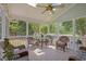 Inviting screened-in porch with vaulted ceilings and outdoor seating area at 2419 Rogerson St, Raleigh, NC 27614