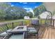 Back deck featuring an outdoor dining set with seating for four at 2528 Barwick Dr, Durham, NC 27704