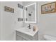 Modern bathroom featuring a vanity with a sleek vessel sink and decorative mirror at 2528 Barwick Dr, Durham, NC 27704