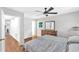 Light-filled bedroom with wood floors and a view into the hallway at 2528 Barwick Dr, Durham, NC 27704
