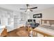 A bright bedroom has wood floors and built-in storage shelves and cabinets at 2528 Barwick Dr, Durham, NC 27704