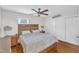 Bedroom featuring a queen-size bed, ceiling fan, and a closet with sliding doors at 2528 Barwick Dr, Durham, NC 27704