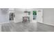 Cozy dining area featuring gray wood floors and a modern chandelier over a dining table at 2528 Barwick Dr, Durham, NC 27704