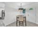 Inviting dining area with modern light fixture and stylish decor, perfect for Gathering meals and entertaining guests at 2528 Barwick Dr, Durham, NC 27704