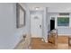 Inviting foyer with hardwood floors, decorative mirror and a stylish table offering a warm greeting at 2528 Barwick Dr, Durham, NC 27704